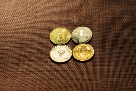 Coin Crypto Currencies. Lying on the background.