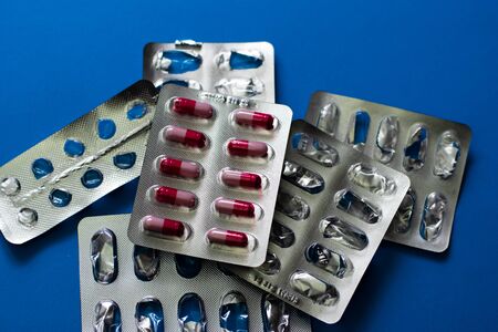 Medicines on a blue background. Treatment of diseases. oncology, vill. AIDS. Stroke.