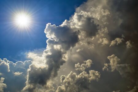 The sun overcomes the clouds. Weather changesの写真素材