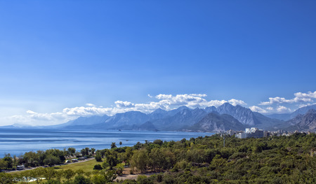 Panoramic view on Antalya beach, mountains and Mediterranean Sea from the Beach park. Antalya, Turkey.の写真素材