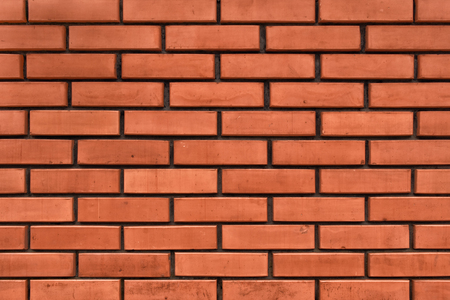 A wall made from red bricks. Brickwork texture.の写真素材