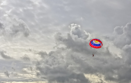 Parasilior in a grey clouds. The active and extreme form of relaxation.の写真素材