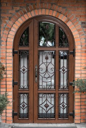 antique arched door with mirror insertsの写真素材