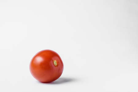 red tomato on a white background. High quality photoの写真素材