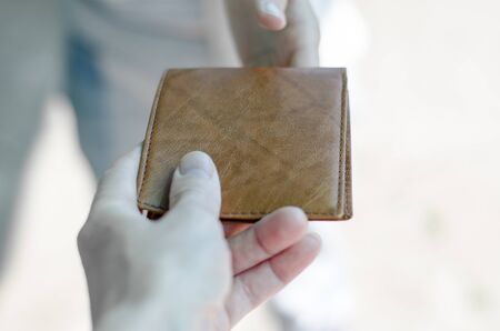 A person gives a wallet to another person. Found a wallet and returns to the owner