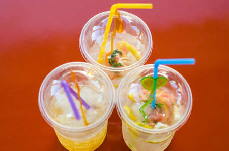 Three glasses of lemonade are on the table. Selective focus
