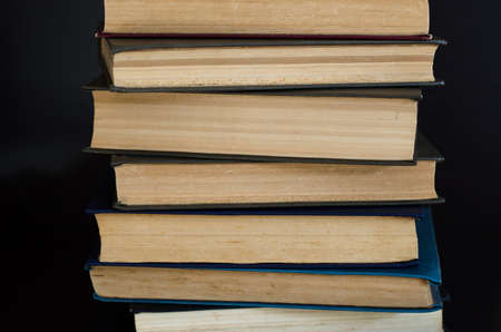 Lots of multi-colored books side view. Home library.の写真素材