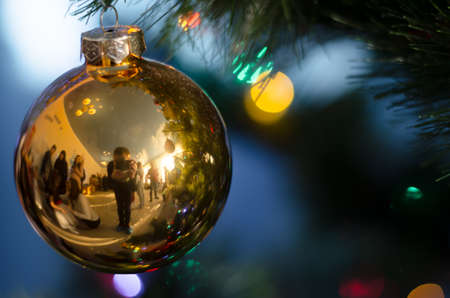 A large golden ball on the tree. Christmas holidays concept. Christmas cardの写真素材
