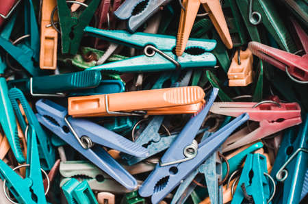 Many multi-colored clothespins close-up as a background.の写真素材