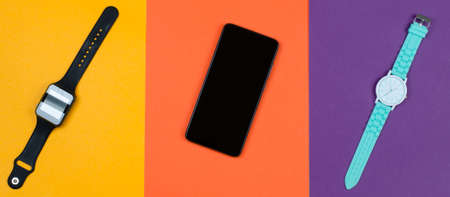 Smart watch, smartphone and mechanical watch on a colorful background. Womens accessories.の写真素材