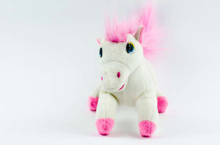 White horse with a pink mane on a white background. Kids toyの写真素材