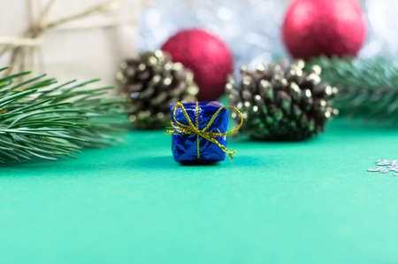 Christmas background with fir branches and Christmas tree decorations. New Year gifts.の写真素材