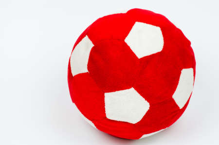 Plush soccer ball red and white. Toy kids ballの写真素材