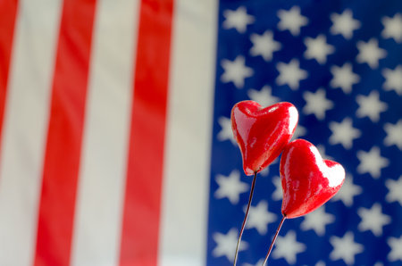 Two red hearts on the background of the American flagの写真素材