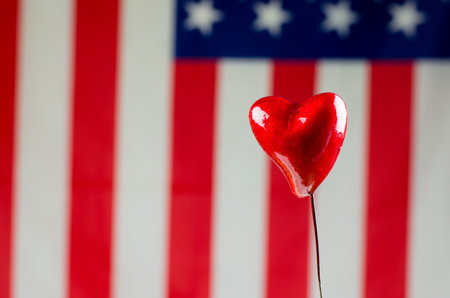 Two red hearts on the background of the American flagの写真素材