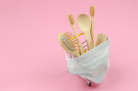 The concept of shopping ecological products online. Wooden personal hygiene items in shopping...