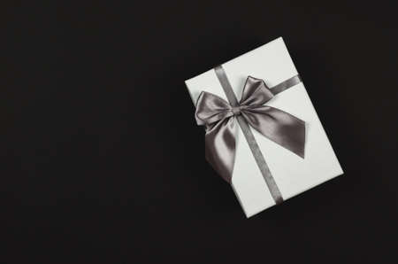 White gift box on a black background. Festive conceptの写真素材