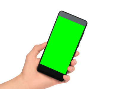 Smartphone with blank green display in female hand on white background, isolate