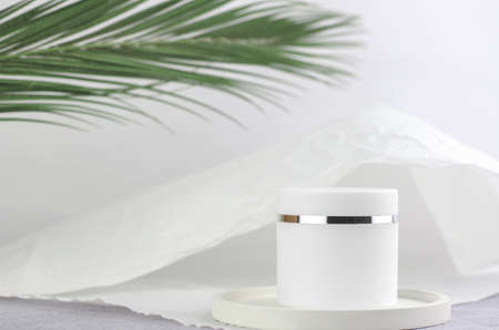 The concept of natural cosmetic products for spa treatments. Moisturizing cream white packaging...