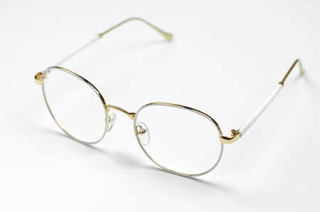 Stylish eyeglasses on a white background. Iron frame glasses