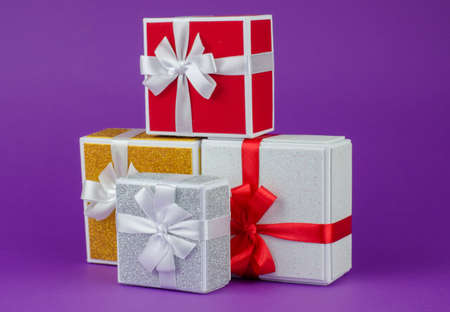 Gift boxes on a purple background. Lots of gift boxesの写真素材