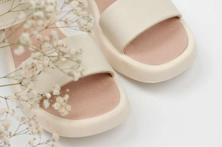 Stylish women's sandals on a white background, close-upの写真素材