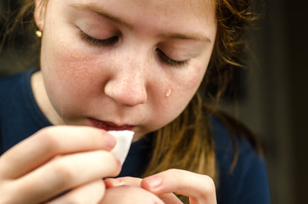Portrait of a crying 11 year old girl, close-upの写真素材
