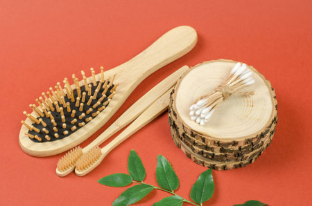Cotton buds on a wooden podium. Personal hygiene items made from natural materials, no plastic, zero wasteの写真素材