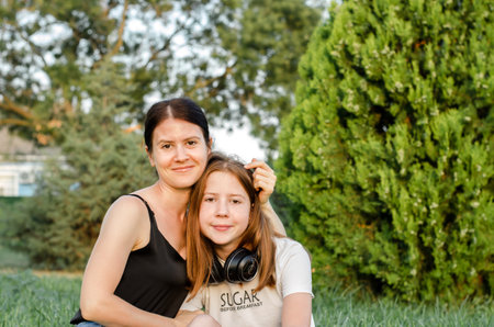Portrait of a mother with her daughter in nature.の写真素材