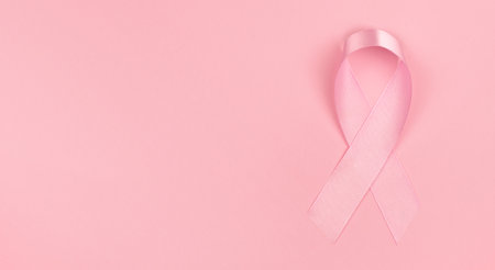 World Breast Cancer Day. Pink ribbon on pink background, copy spaceの写真素材