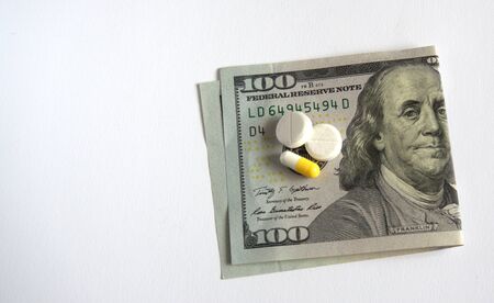 money with pills on white background