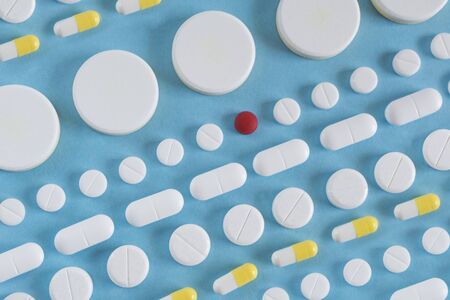 rows of pills on blue background. medicine concept or backgroundの写真素材