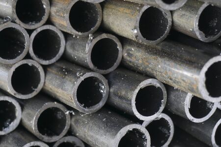 industrial background. cylindrical metal details on grey backgroundの写真素材