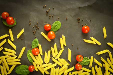 vegetables with italian pasta, macaroni. spinach, cherry tomatoes , cheeseの写真素材