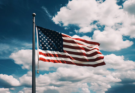 the flag of the United States of America fluttering in the wind against a blue sky with clouds. illustration created by Generative AIの素材