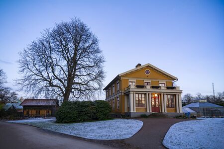 Gothenburg Sweden - Nov 21 2017: Early winter evening in Horticultural Society park during sunset with first snowのeditorial素材
