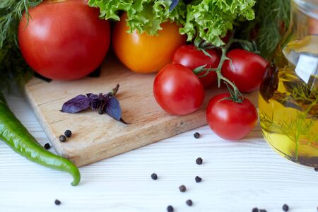 Composition with vegetables and spices on a table on a white backgroundの写真素材