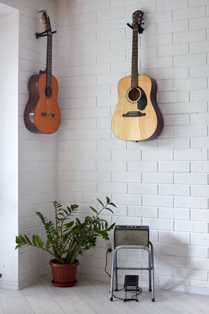 Some guitars hanging on the wallの写真素材