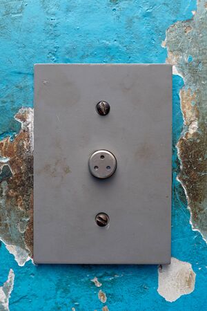 Elevator call button in old house