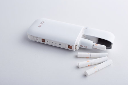 October 19.2019, Kiev, Ukraine : IQOS electronic cigarette of a new generation from the company Philip Morris, isolated on white background.のeditorial素材