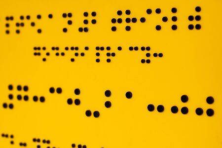 Close up of braille Code. Yellow abstract backgrounds and texturesの写真素材
