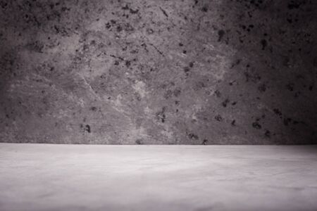 Empty room with concrete wall, grey background.の写真素材