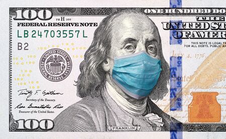 COVID-19 coronavirus in USA, 100 dollar money bill with face mask. Crisis and finance conceptの写真素材