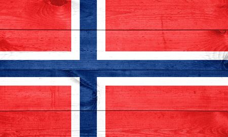 norway, norwegian flag painted on old wood plank backgroundの写真素材