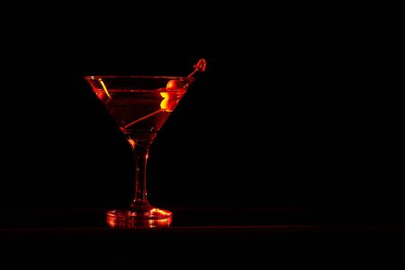 French Martini cocktail, consisting of vodka, raspberry liqueur and freshly squeezed pineapple juice. Isolated on black background.の写真素材