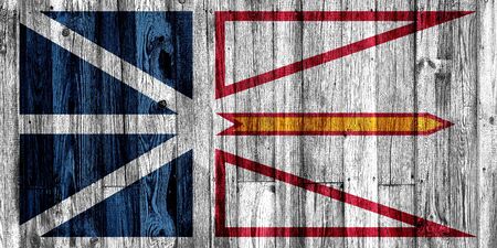 Newfoundland and Labrador flag painted on wooden background, closeup.の写真素材