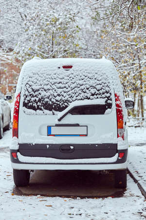 Back window of white car parked on the street in winter day, rear view. Mock-up for sticker or decalsの写真素材