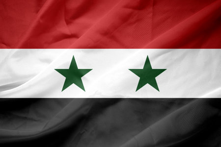 Close up of the national flag of Syria waving in the windの写真素材