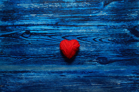 Decorative hearts on blue wooden backgroundの写真素材
