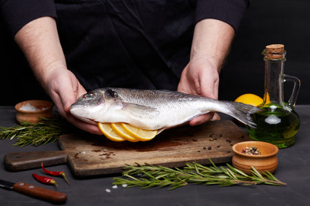Process of cooking dorado fish with lemon and herbs.の写真素材